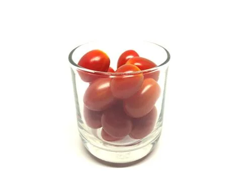 Cherry tomatoes in glass Isolated on white background Stock Photos