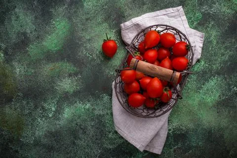 Cherry tomatoes on green background Stock Photos
