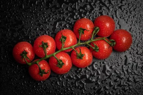 Cherry tomatoes isolated on black background Stock Photos