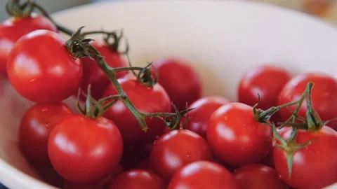 Cherry tomatoes at the kitchen Stock Footage 143780389