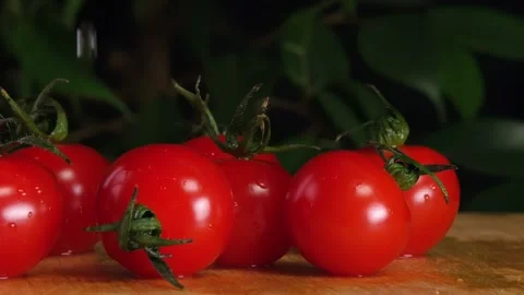 Cherry tomatoes in the kitchen, tomatoes thrown on the table Stock Footage 265142199