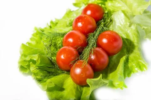 Cherry tomatoes on lettuce leaf Stock Photos