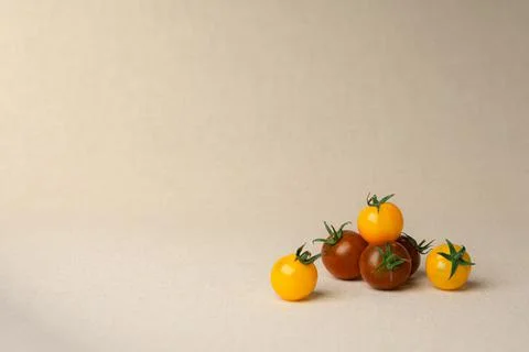 Cherry tomatoes at the linen background colored Stock Photos