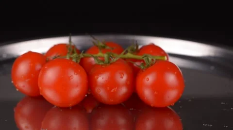 Cherry tomatoes on metallic plate Stock Footage 65227869