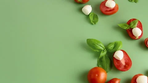 Cherry tomatoes mozzarella and basil in composition Stock Footage 314417880