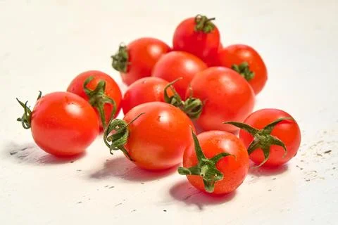 Cherry tomatoes, organic tomatoes on a light background Stock Photos