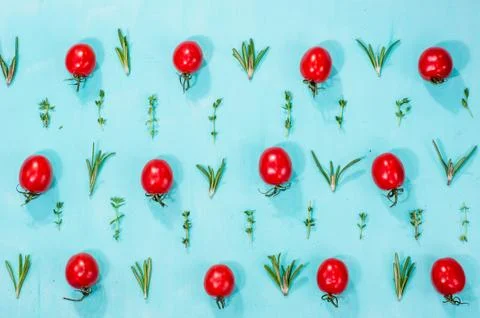 Cherry tomatoes pattern with rosemary and thyme Photos