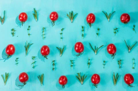 Cherry tomatoes pattern with rosemary and thyme Stock Photos