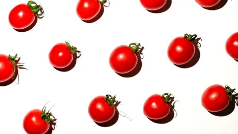 Cherry tomatoes rotating over white background Stock Footage 119672964