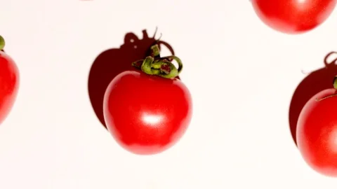 Cherry tomatoes rotating over white background, slight zoom out Stock Footage 119693702