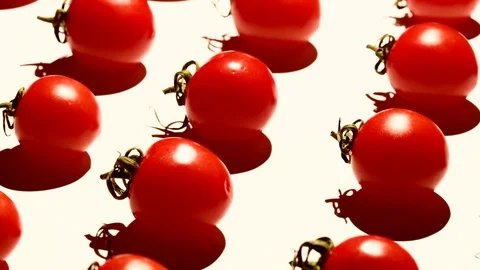 Cherry tomatoes rotating over white background Stock Footage 119694580