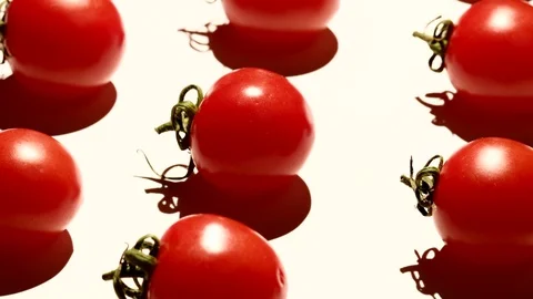 Cherry tomatoes rotating over white background Stock Footage 119694749