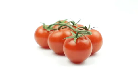 Cherry Tomatoes Rotating On White background Stock Footage 233425840