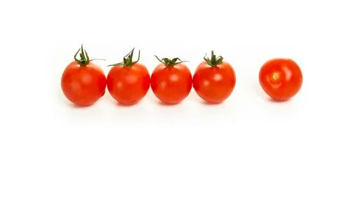 Cherry tomatoes in a row on a white background Stock Photos