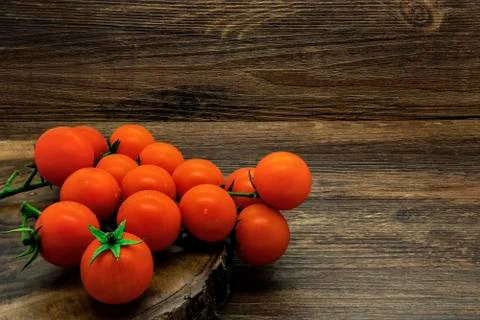 Cherry tomatoes on a rustic background Stock Photos