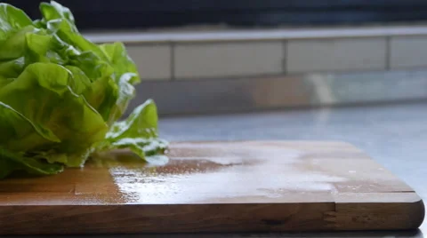 Cherry tomatoes slide on a cutting board 스톡 동영상 68996038