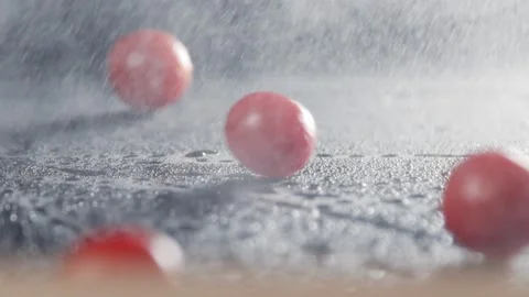 Cherry tomatoes in slow motion falling on the table. Stock Footage 140498181