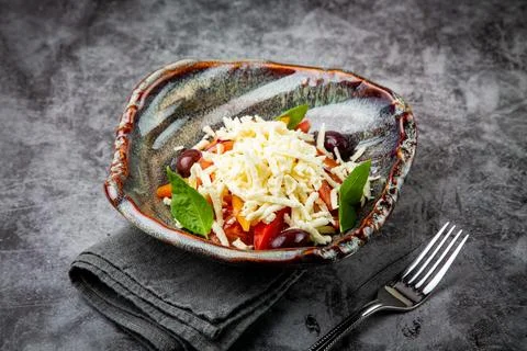 Cherry tomatoes, spinach, eel, lime, cheese, side view Stock Photos