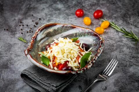 Cherry tomatoes, spinach, eel, lime, cheese, side view Stock Photos