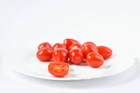 Cherry tomatoes stack isolated on white background Stock Photos