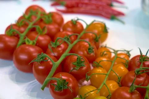Cherry tomatoes on a store counter. Stock Photos