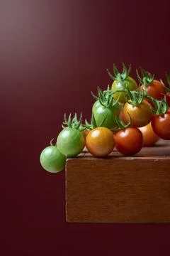 Cherry tomatoes on a table top, closeup Stock Photos