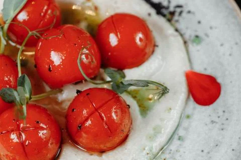 Cherry tomatoes with tofu mousse on a plate. place for inscription Stock Photos