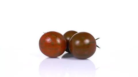 Cherry tomatoes turning on white background. 4k Video Stock Footage 171634855