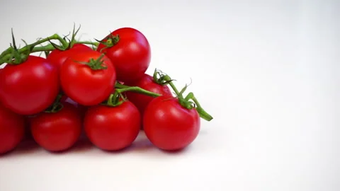 Cherry tomatoes on a white background Stock Footage 131468141