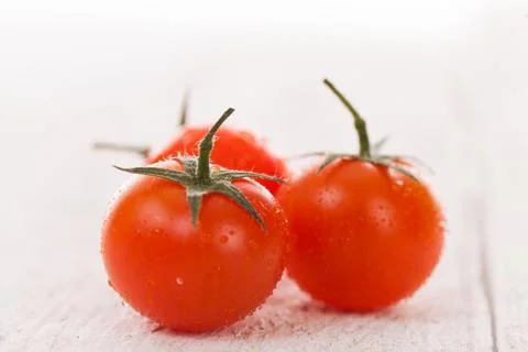 Cherry tomatoes on a white background Stock Photos