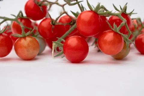 Cherry tomatoes on a white background Stock Photos