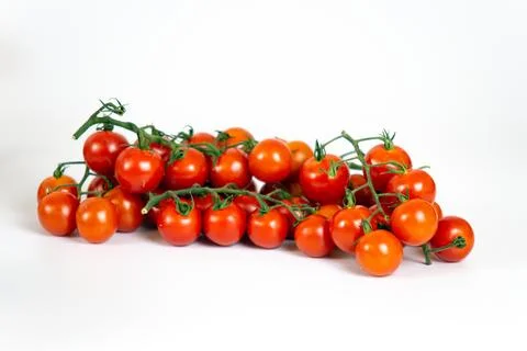 Cherry tomatoes on a white background. Stock Photos