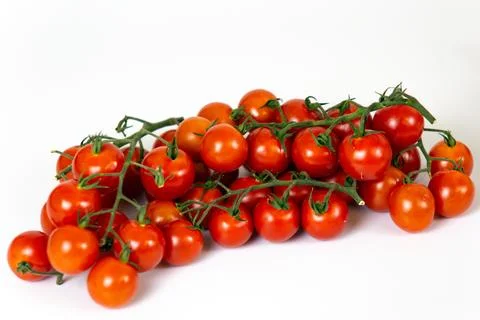 Cherry tomatoes on a white background. Stock Photos