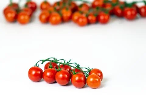 Cherry tomatoes on a white background. Stock Photos