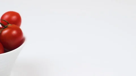 Cherry tomatoes in a white plate in the kitchen. Stock-Footage 86680719