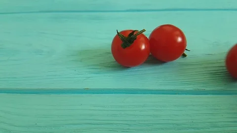 Cherry tomatoes on a wooden Stock Footage 87827852