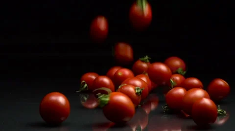 Cherry Tomatos Falling in Slow Motion Stock Footage 67648380