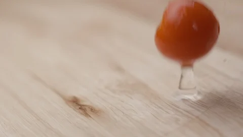 Cherry tomoatoes falling with water slow motion HD Stock Footage 113976060