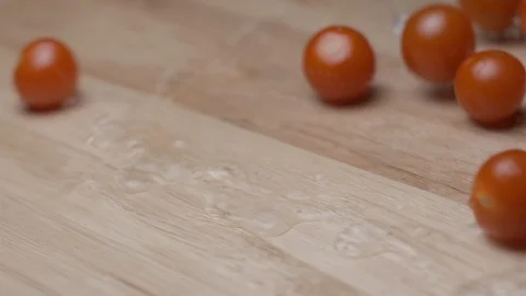 Cherry tomoatoes falling with water slow motion HD Stock Footage 113976106