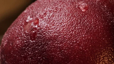Cherry with water droplets closeup rotates on a dark background Stock Footage 102560055