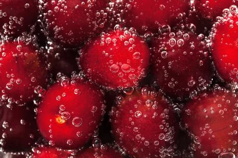Cherry in water Stock Photos