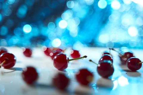Cherry on a white background with blue highlights and shadows. Close-up. Top  Stock Photos