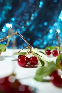 Cherry on a white background with blue highlights and shadows. Close-up. Top  Stock Photos