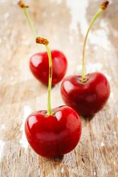 Cherry on wood Stock Photos