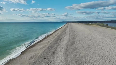 Chesil Beach from a drone, West Bay to Portland, Jurassic Coast, Dorset, England Stock Footage 304549839