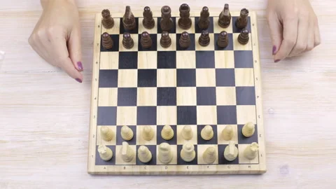 Chess and female hands on a table Video stock 99505775
