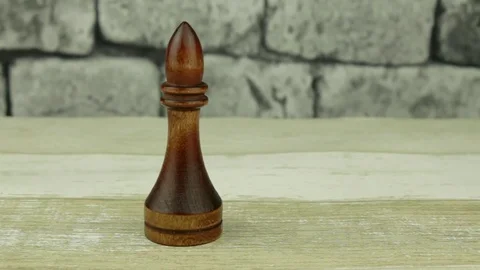 Chess bishop on a brick background Stock Footage 78333086