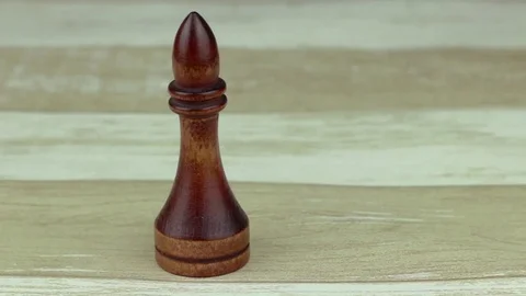 The chess bishop on wood background Stock Footage 78184785