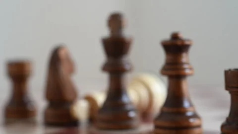 Chess, black king faces white king,, white king is knocked over (with slider) Stock Footage 110933824