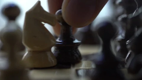 Chess. black pawn eats white horse Stock Footage 127051826